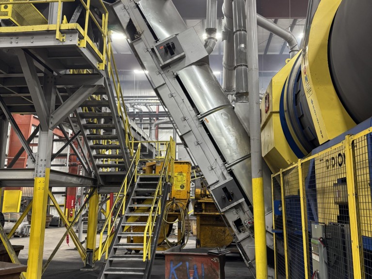 This is one of 2 conveyors at a Midwest foundry that recently installed our Sidewall NA belt on. Besides the 42” high temperature pocketbelt, the customer also utilized our custom stub rollers and as shown our guide wheel assemblies MidwewstFoundryConveyer